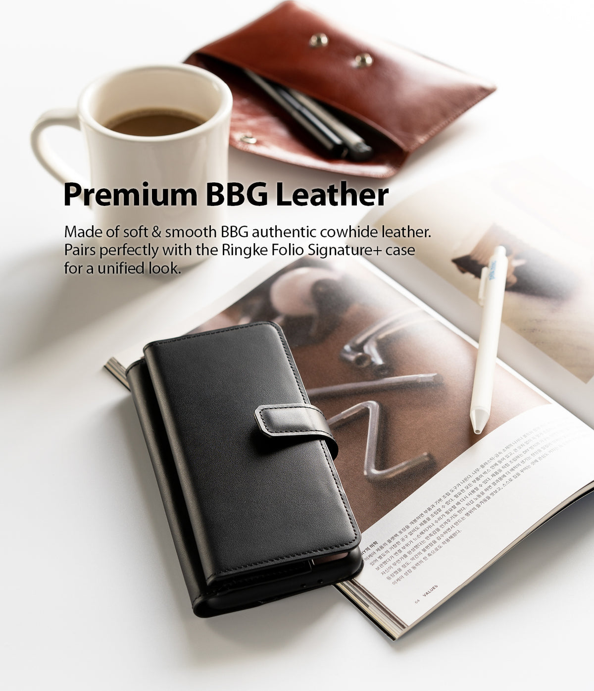 Galaxy S21 Case | Folio Signature+ - Black leather folio case resting on an open magazine next to a coffee mug.