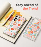 Galaxy S22 Ultra Case | Fusion Design - Clear phone cases with colorful floral patterns on a notebook with a pen.
