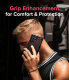 Galaxy S22 Ultra Case | Fusion-X - Man in a gym holding a black Fusion-X phone case to his ear with text overlay.