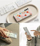 Galaxy S22 Plus Case | Fusion Design - Clear phone cases with floral and Seoul typography patterns held by hands.