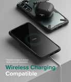 Galaxy S22 Plus Case Combo | Fusion-X Case + Screen Protector + Camera Protector - Galaxy S22 Plus Case Combo - Galaxy S22 Plus in a black Fusion-X case charging wirelessly with earbuds on top.
