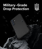 Galaxy S23 FE Case | Onyx - Black phone case floating above jagged rocks with debris, featuring military-grade drop protection text.
