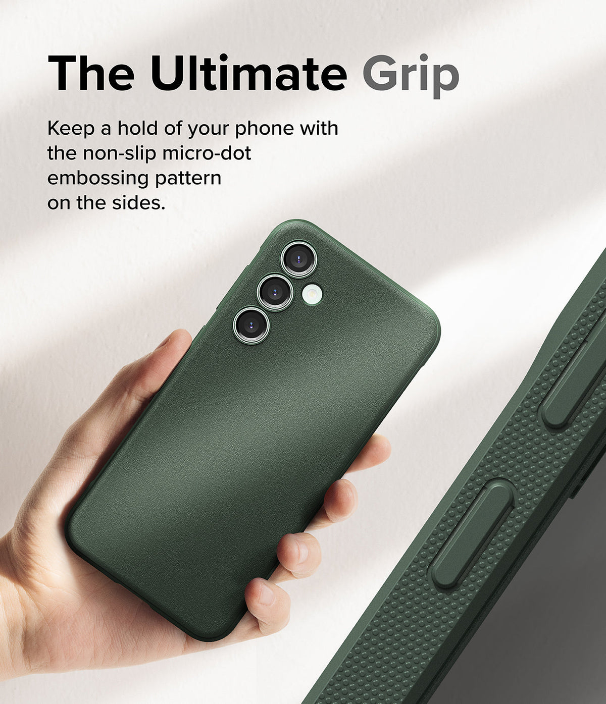 Galaxy S23 FE Case | Onyx - Hand holding a dark green phone case with a textured micro-dot grip pattern on the side.