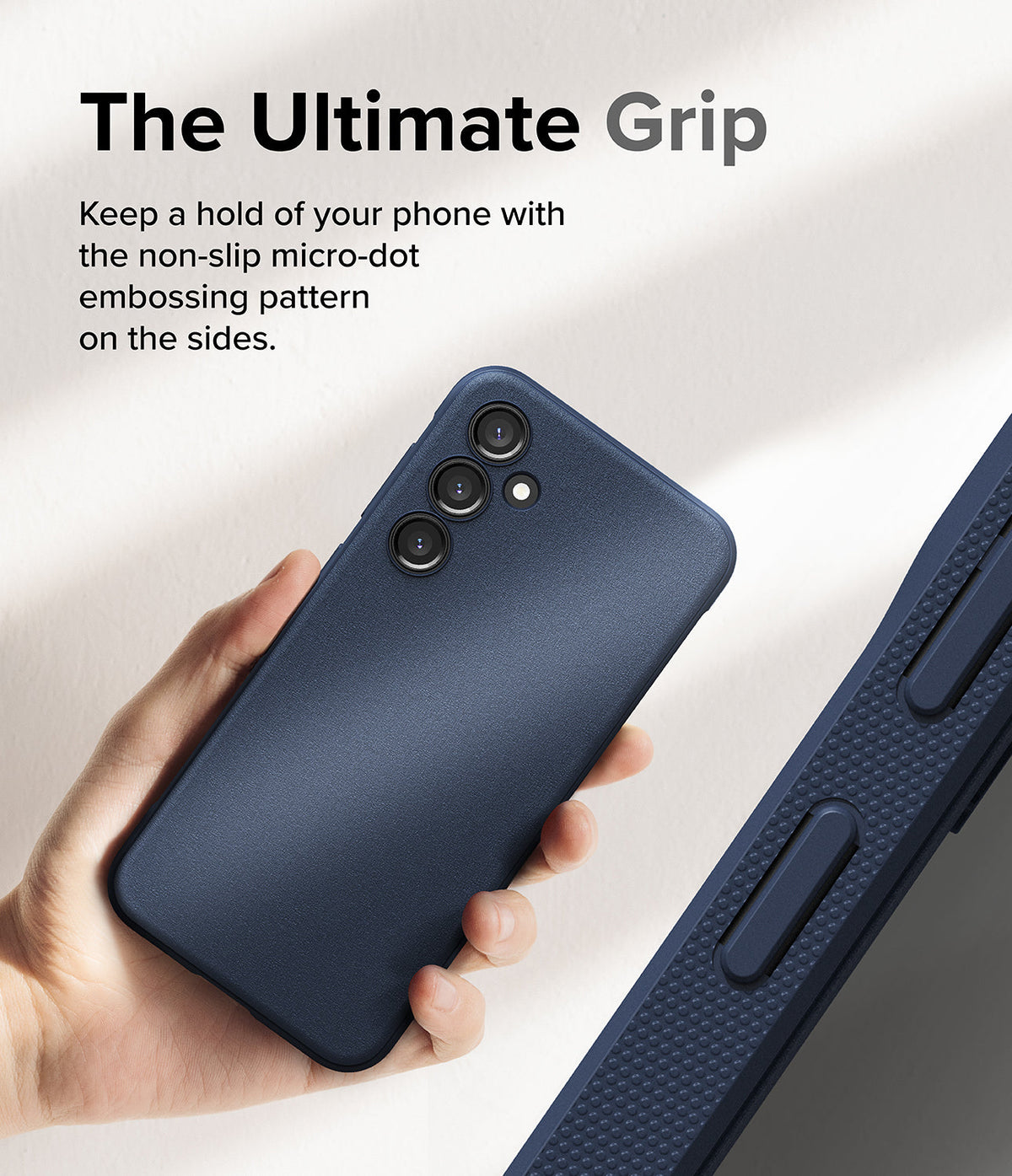 Galaxy S23 FE Case | Onyx - Hand holding a navy phone case with a textured micro-dot side grip pattern.