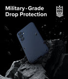 Galaxy S23 FE Case | Onyx - Navy phone case floating above jagged rocks with debris, featuring military-grade protection text.