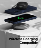 Galaxy S23 FE Case | Onyx - Navy phone case on a wireless charging pad with a 70% battery icon displayed on the screen.
