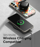 Galaxy S23 Plus Case | Fusion Design - Clear floral phone case on a wireless charger with charging earbuds on top.