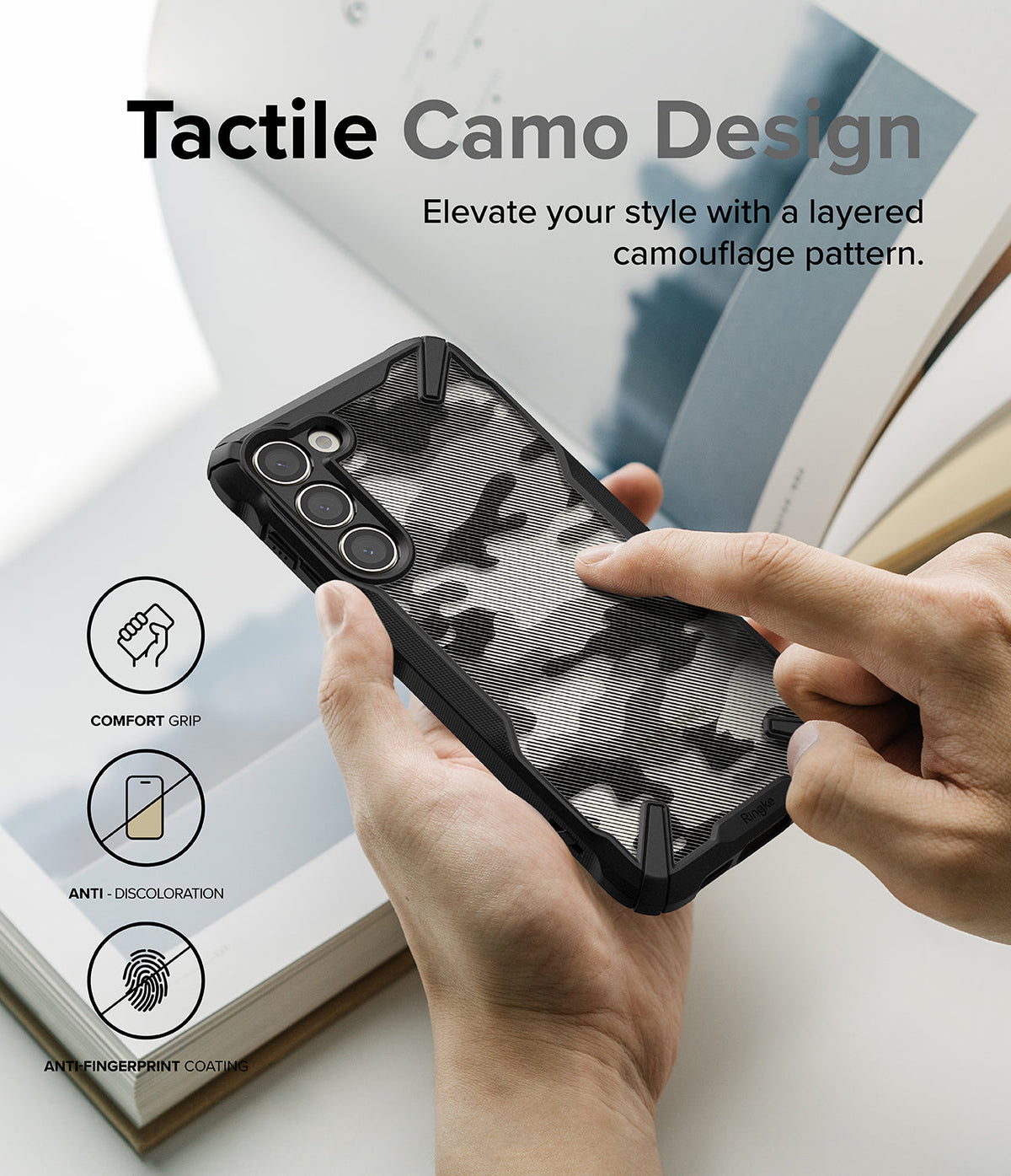 Galaxy S23 Plus Case | Fusion-X - Hands holding a black phone case with a tactile, layered camouflage pattern and feature icons.