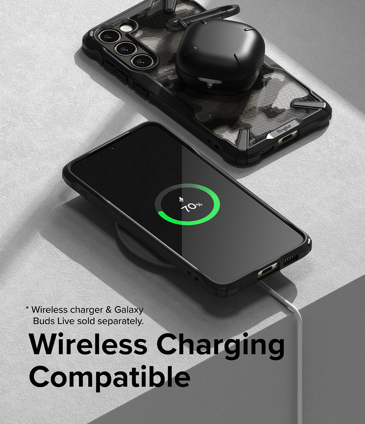 Galaxy S23 Plus Case | Fusion-X - Phone in a black case wirelessly charging with earbuds case resting on another phone.