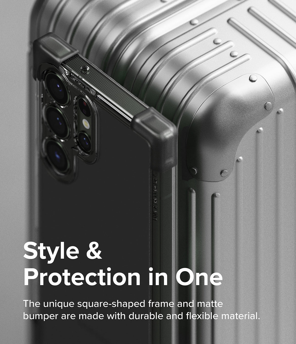 Galaxy S23 Ultra Case | Fusion Bumper - A black phone case with reinforced corner bumpers resting against a silver suitcase.