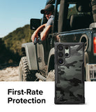 Galaxy S23 Ultra Case | Fusion-X - Camo phone case with rugged black frame shown next to a person in an off-road vehicle.