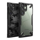 Galaxy S23 Ultra Case | Fusion-X - Two Samsung Galaxy S23 Ultra phones with black rugged cases, one camo and one clear.