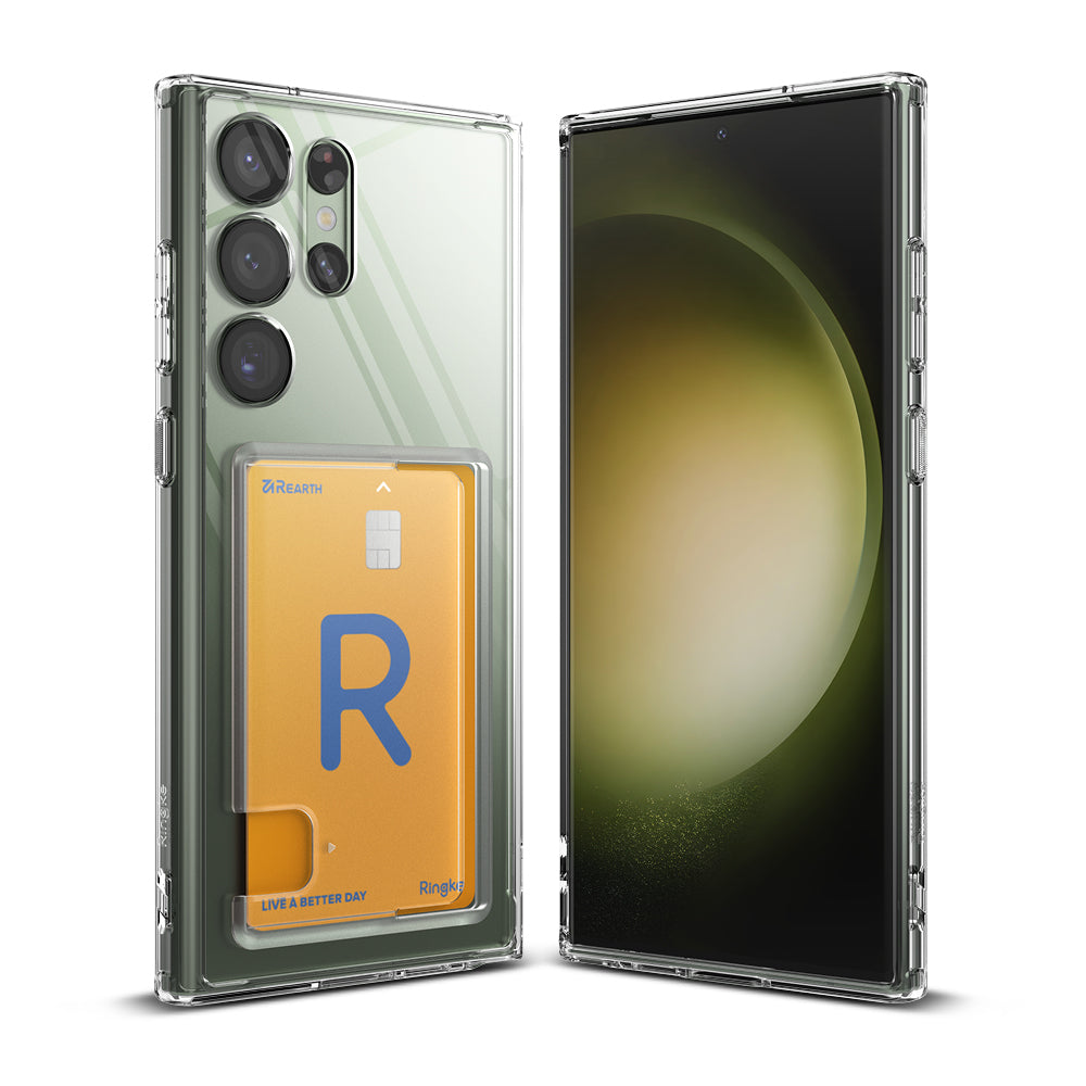 Galaxy S23 Ultra Case | Fusion Card - Clear phone case with a card slot holding a yellow card on a green smartphone.