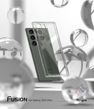 Galaxy S23 Ultra Case | Fusion - Clear protective phone case floating in front of a green Galaxy S23 Ultra amidst glass orbs.