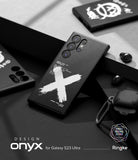 Galaxy S23 Ultra Case | Onyx Design - Black phone case with a white brushstroke X and technical text on a dark surface.