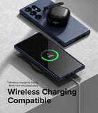 Galaxy S23 Ultra Case | Onyx - Navy blue phone case on a Galaxy S23 Ultra charging wirelessly with black earbuds on top.
