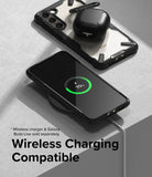 Galaxy S23 Case | Fusion-X - A Galaxy S23 in a black Fusion-X case wirelessly charging with earbuds on top.