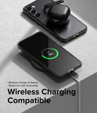 Galaxy S23 Case | Fusion - A Galaxy S23 in a clear case wirelessly charging, with a black earbud case resting on top.