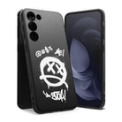 Galaxy S23 Case | Onyx Design - Black phone case with white graffiti-style smiley face and text on a textured background.