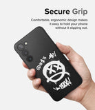Galaxy S23 Case | Onyx Design - Hand holding a black phone case with white graffiti-style skull art and text.