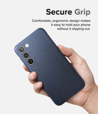 Galaxy S23 Case | Onyx - A hand holding a dark blue Galaxy S23 phone case with a textured, ergonomic design.