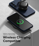 Galaxy S23 Case | Onyx - Navy Galaxy S23 case with wireless charging, showing a phone and earbuds case on a charging pad.