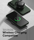 Galaxy S23 Plus Case | Onyx - Dark green phone case on a wireless charger with earbuds case resting on top.