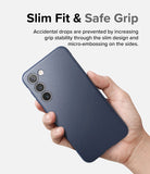 Galaxy S23 Plus Case | Onyx - Hand holding a navy blue textured phone case with a triple camera cutout and flash.