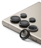 Galaxy S24 Ultra Lens Protector | Camera Lens Frame Glass - Galaxy S24 Ultra Lens Protector - Black metal camera lens covers installed on a beige smartphone with one spare ring.
