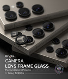 Galaxy S24 Ultra Lens Protector | Camera Lens Frame Glass - Galaxy S24 Ultra Lens Protector - Black glass lens covers being applied to the camera array of a titanium smartphone.