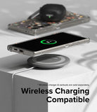 Galaxy S24 Ultra Case | Fusion Design - Phone in clear case wirelessly charging on a pad with earbuds in the background.