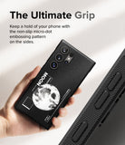 Galaxy S24 Ultra Case | Onyx Design - Hand holding a black phone case with a moon graphic and micro-dot side grip texture.
