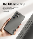 Galaxy S24 Ultra Case | Onyx - Hand holding a grey phone case with a micro-dot textured side grip and camera cutouts.