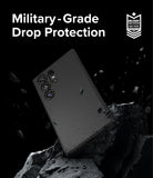 Galaxy S24 Ultra Case | Onyx Magnetic - Black phone case floating above jagged rocks with debris and military-grade badge.