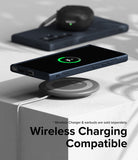 Galaxy S24 Ultra Case | Onyx - Onyx case on a Galaxy S24 Ultra wirelessly charging on a pad with earbuds in the background.