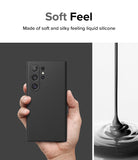 Galaxy S24 Ultra Case | Silicone Magnetic - Hand holding a black phone case next to a stream of liquid silicone.