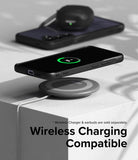 Galaxy S24 Case | Fusion Bold - A black phone in a protective case wirelessly charging on a circular pad.