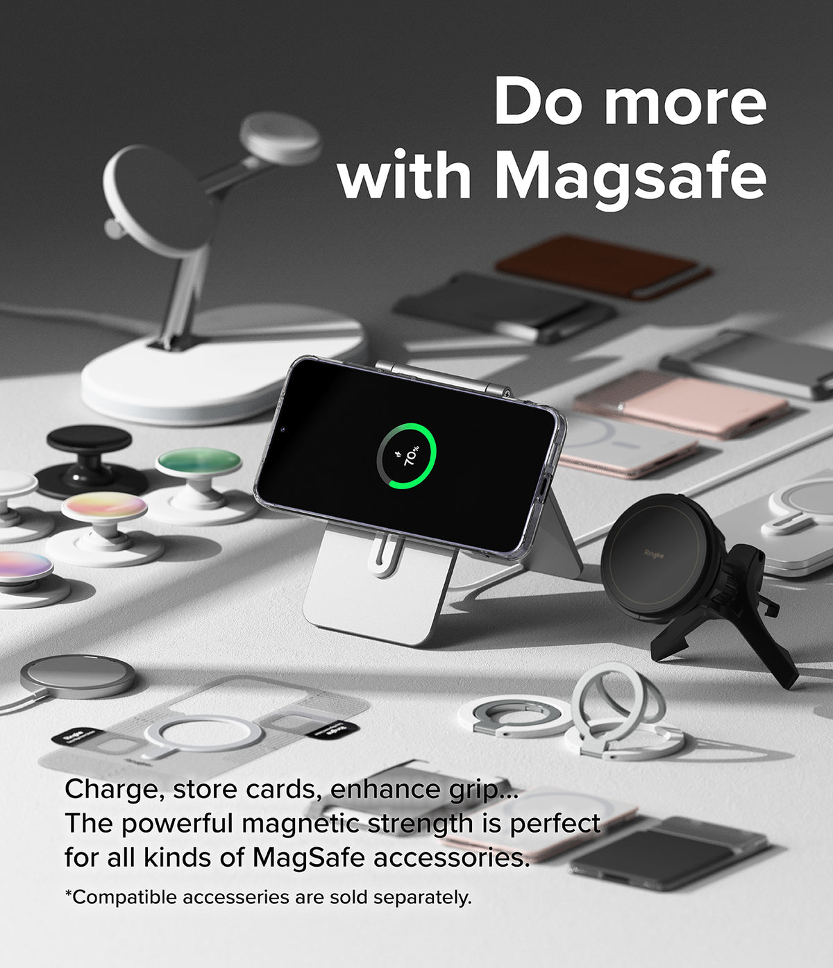 Galaxy S24 Case | Fusion Magnetic - A phone in a clear case charging on a stand surrounded by various MagSafe accessories.