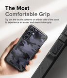 Galaxy S24 Case | Fusion-X - Hand holding a camo-patterned phone case with textured side grips for improved stability.