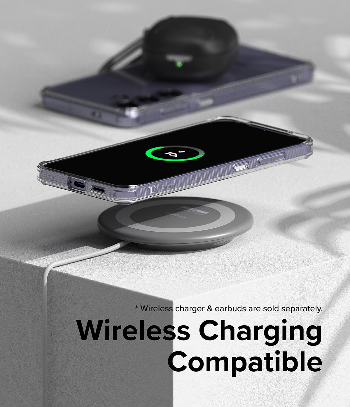 Galaxy S24 Plus Case | Fusion - Clear phone case on a wireless charging pad showing a 70% battery charge icon on screen.