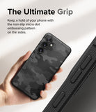 Galaxy S24 Plus Case | Onyx Design - Hand holding a black camo phone case with side micro-dot grip texture.