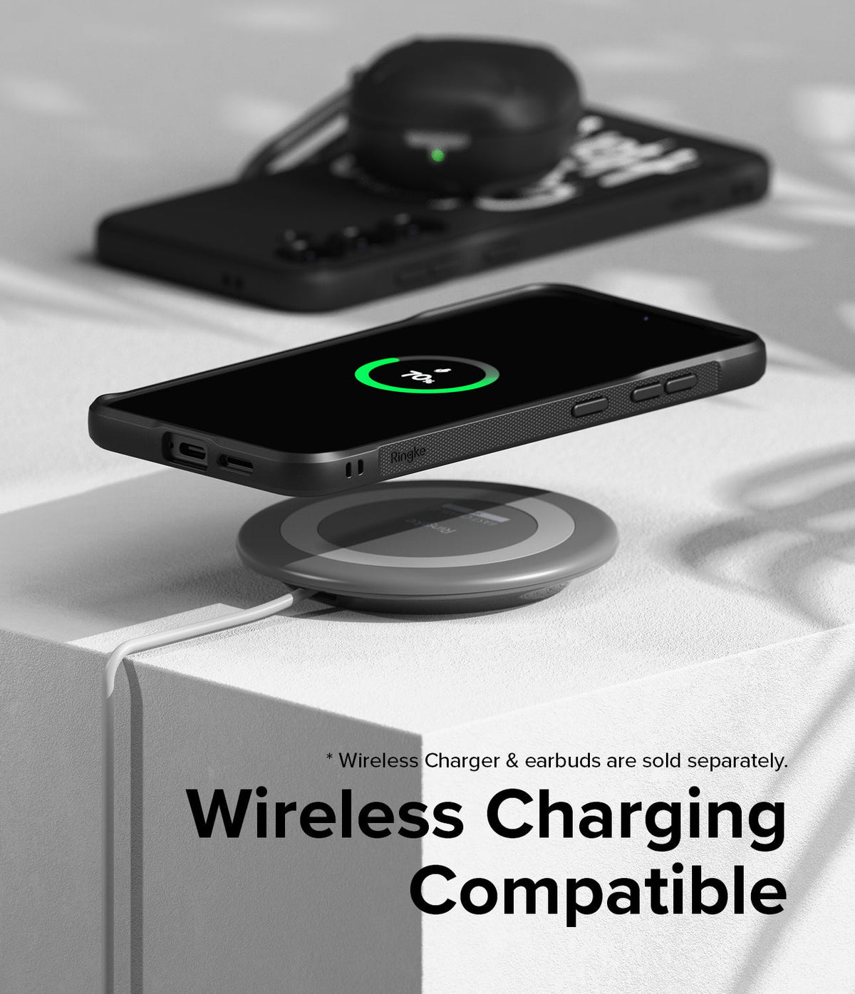 Galaxy S24 Plus Case | Onyx Design - Black phone case on a wireless charging pad showing a 70% battery charge icon.