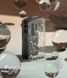Galaxy S25 Ultra Case | Fusion Design [Dry Flowers] - Clear phone case with floral print standing beside a black phone.
