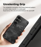 Galaxy S25 Case | Onyx - Hand holding a black camo-patterned phone case with textured sides for improved grip.