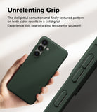 Galaxy S25 Case | Onyx - Hand holding a dark green phone case with a textured grip and triple camera cutout.