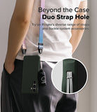 Galaxy S25 Case | Onyx - Person wearing a phone case with a colorful strap and accessory, highlighting the duo strap hole.