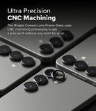 Galaxy S25 Plus | Camera Lens Frame Glass - Close-up of black camera lens protectors being applied to smartphone lenses.