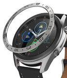 Galaxy Watch 3 (45mm) | Bezel Styling - A metallic numbered bezel ring hovering above a Galaxy Watch 3 with a black leather strap.