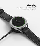 Galaxy Watch 3 (45mm) | Bezel Styling - A Galaxy Watch 3 with a silver bezel accessory charging wirelessly on a black puck.