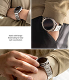 Watch Lug 20mm | Metal One Band - Silver metal watch band on a smartwatch worn with a tan sweater and black pants.